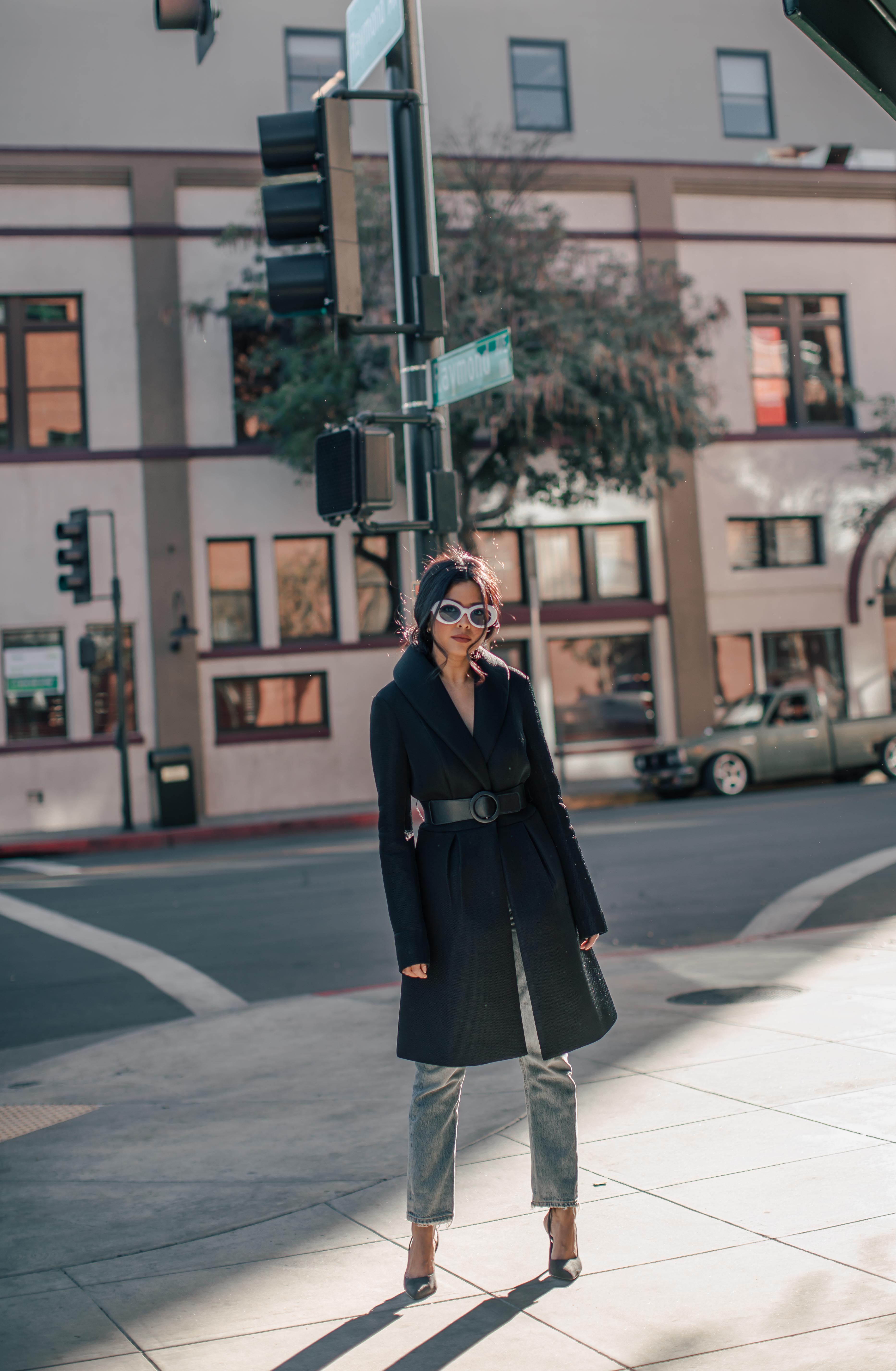 Sheryl Luke from Walk In Wonderland Wearing Eva Longoria Black Flare Perforated Coat