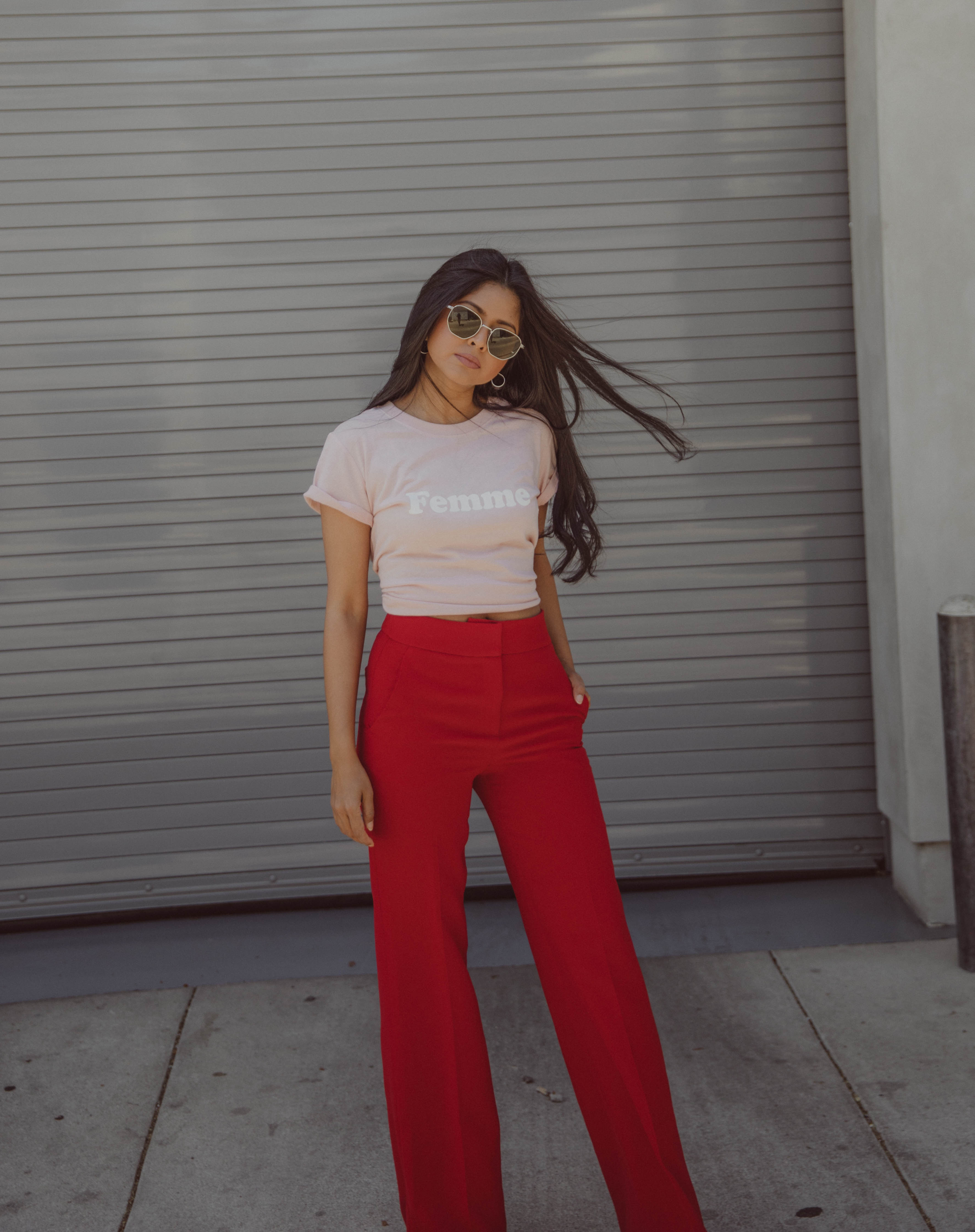Sheryl wearing Red wide leg pants and femme Tshirt