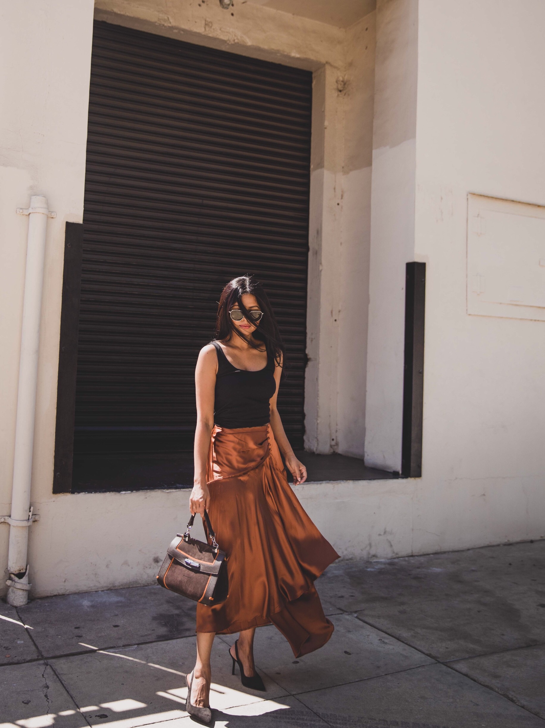I am beginning to introduce fall tones into my summer wear since we are in transition. I found this satin midi skirt in Bronze which I've linked here for you but there are so many stunning and affordable pieces